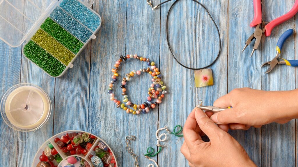 Handmade beaded bracelets and jewelry being crafted by a local artisan
