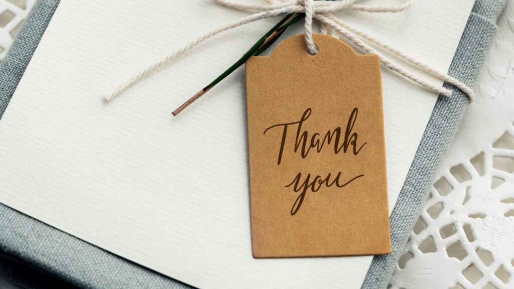 Personalized wedding thank-you card with a gift tag