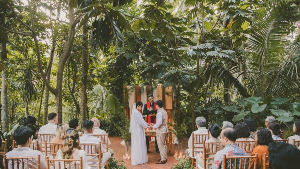 Wedding ceremony with guests in a tropical Ubud setting